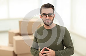 Young man, on the background of the new apartments