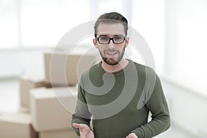 Young man, on the background of the new apartments