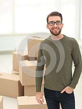 Young man, on the background of the new apartments