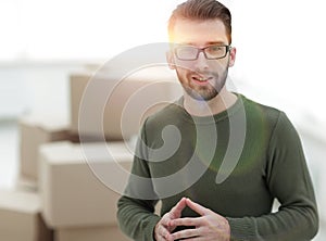 Young man, on the background of the new apartments