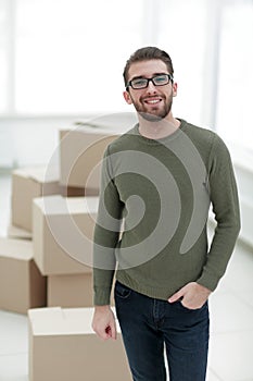 Young man, on the background of the new apartments