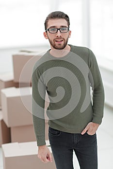 Young man, on the background of the new apartments