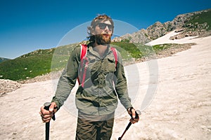 Young Man with backpack hiking outdoor Travel Lifestyle concept