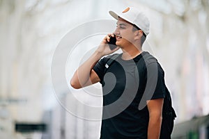 Young man with the backpack at the train station