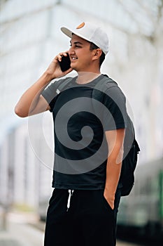 Young man with the backpack at the train station