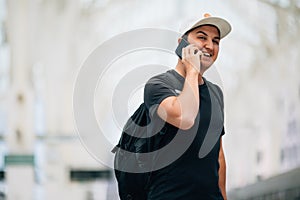Young man with the backpack at the train station