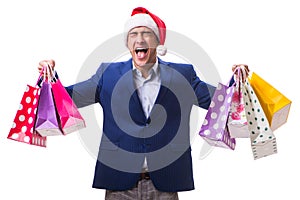The young man with bags after christmas shopping on white background