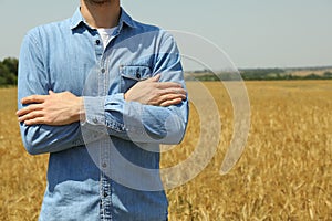 Young man in barley field Agriculture business. Farming