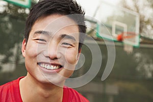 Young man on the basketball court, portrait