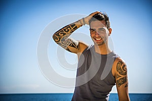 Young Man at Beach in Sunny Summer Day