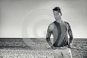 Young Man at Beach in Sunny Summer Day