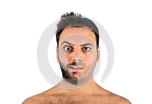 A young man with a beard on half of the face