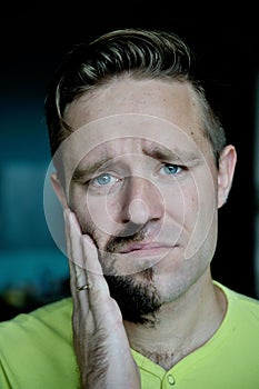 Young man with a beard on half of the face