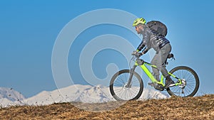 Young man with beard in mountain bike