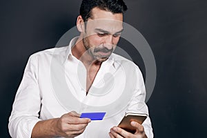 Young man using mobile payment