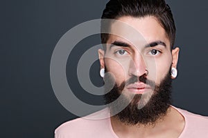 Young man with beard and piercings photo