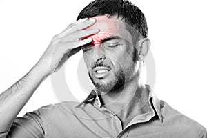 Young Man with Beard suffering Headache and migraine in pain expression photo
