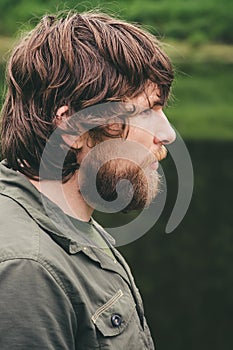 Young Man bearded curly hair portrait outdoor Lifestyle