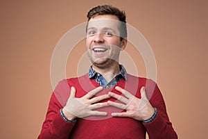 Young man being content to hear compliment