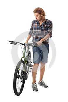 Young man with bicycle on background