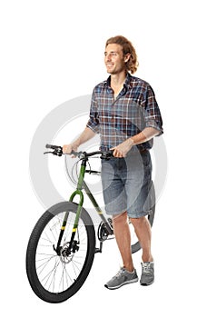 Young man with bicycle on white