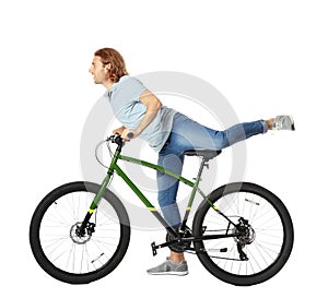 Young man with bicycle on white