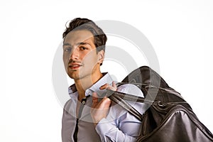 Young man with big leather bag over shoulder