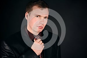 Young man on a black background