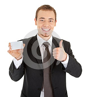 Young man in a black business suit and card in his