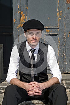 Young man in black cap in vintage style