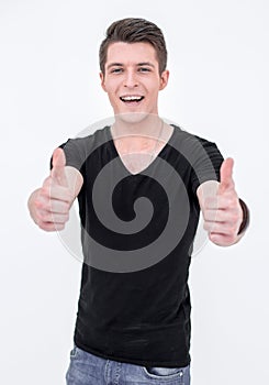 Young man in black t shirt shows thumb up.