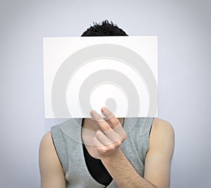 Young man with blank card