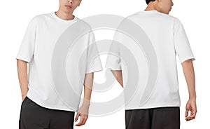 Young man in blank oversize t-shirt mockup front and back used as design template, isolated on white background photo