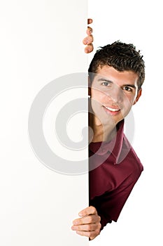 Young man with blank sign