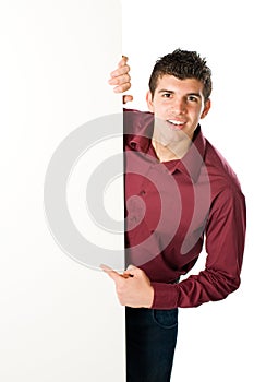 Young man with blank sign