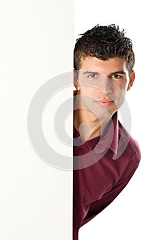 Young man with blank sign