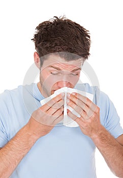 Young Man Blowing His Nose
