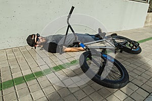 Young man with a bmx bike on the street.Rider BMX