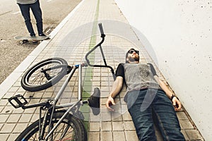 Young man with a bmx bike on the street.Rider BMX