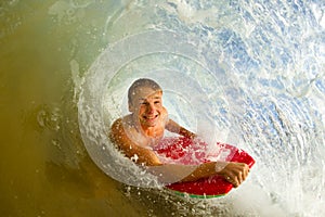 Young man body boarding