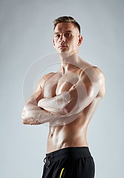 Young man or bodybuilder with bare torso