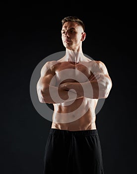 Young man or bodybuilder with bare torso