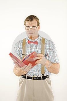 Young man with book open.