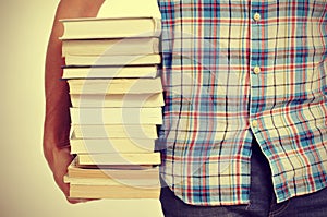 Young man with books, with a filter effect