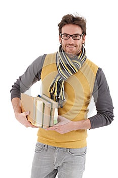 Young man with books smiling