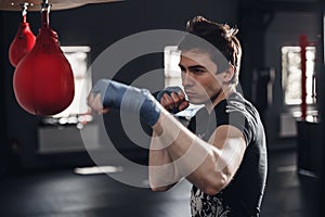 Young man boxing workout in a fitness club