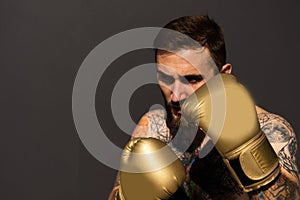 Young man boxing workout in an old building