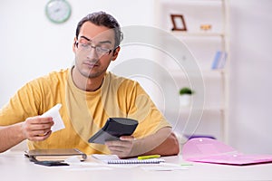 Young man in budget planning concept