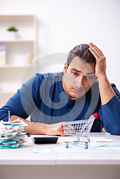 Young man in budget planning concept