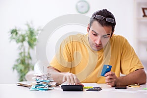 Young man in budget planning concept